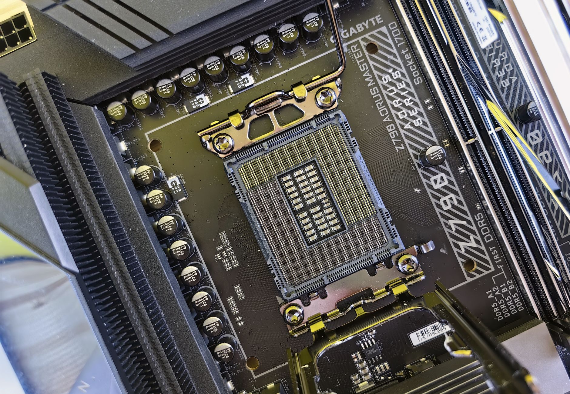 Detailed view of a computer motherboard socket showcasing advanced electronic components and technology.