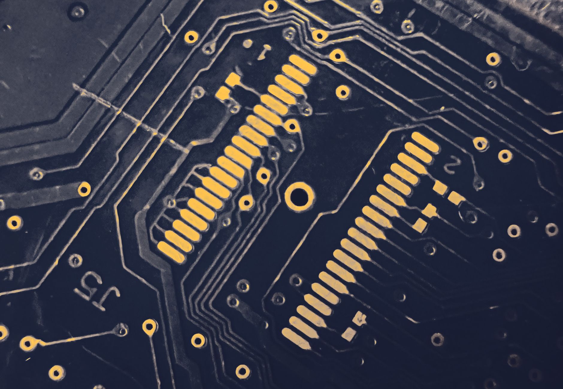 Detailed view of a modern electronic circuit board showing intricate pathways and components.