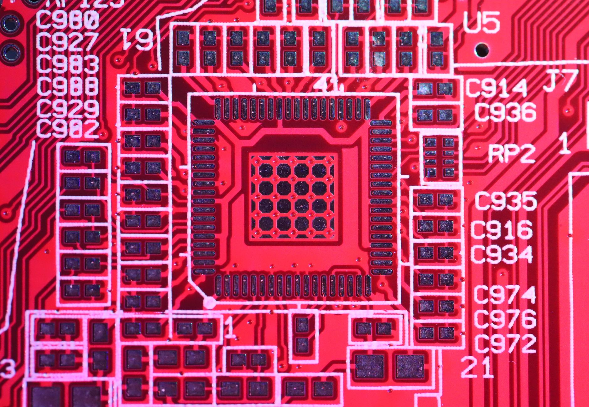 Top view of colorful printed board with bright electric circuits of modern technical machine with various figures and letters on surface