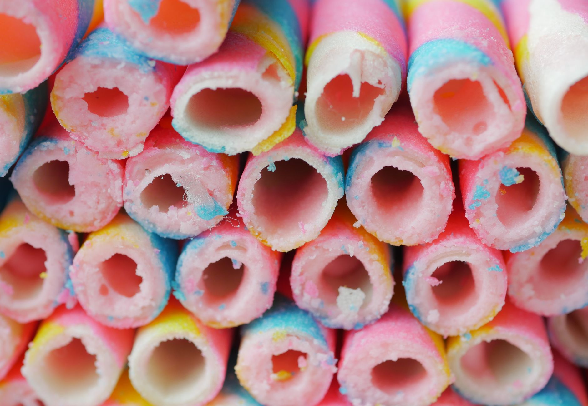 Vibrantly colored wafer sticks in a close-up view, showcasing their delicious texture.