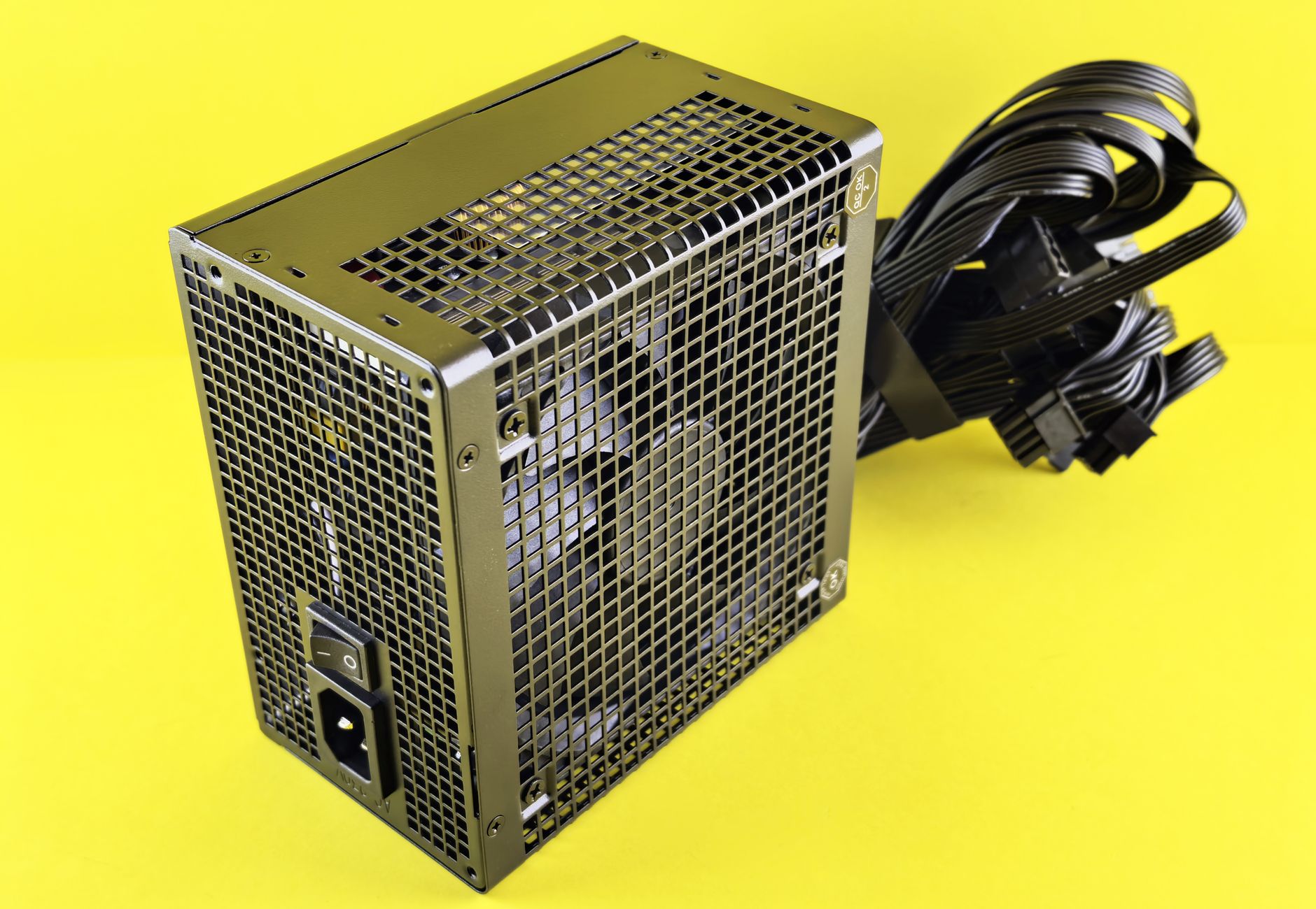 A powerful gaming PSU on yellow background, ideal for desktop setups.